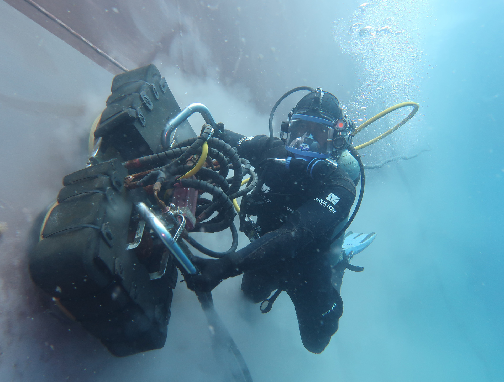 Aqua Port commercial diver performing underwater ship repair